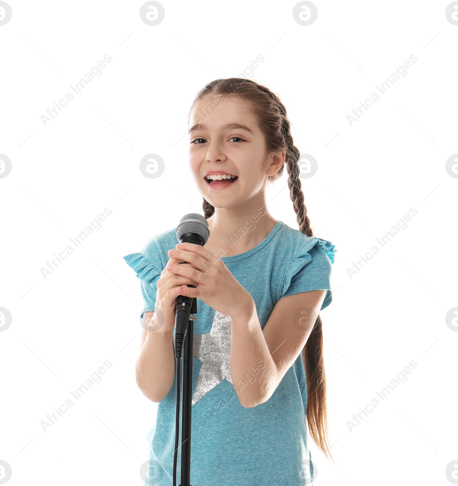 Photo of Cute girl singing in microphone on white background