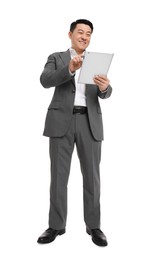 Photo of Businessman in suit using tablet on white background, low angle view