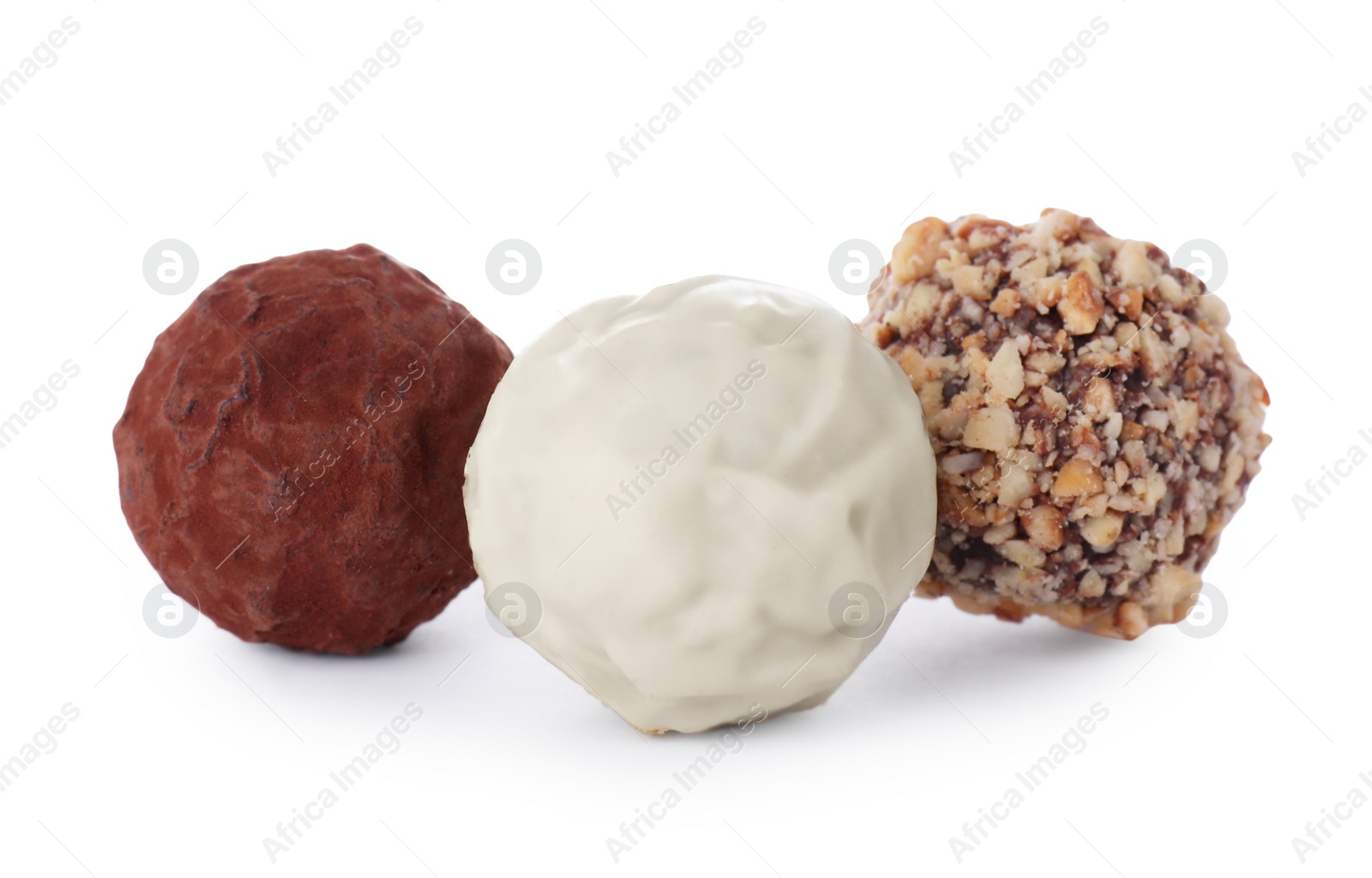 Photo of Different tasty chocolate candies isolated on white
