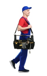 Photo of Young plumber with tool bag on white background