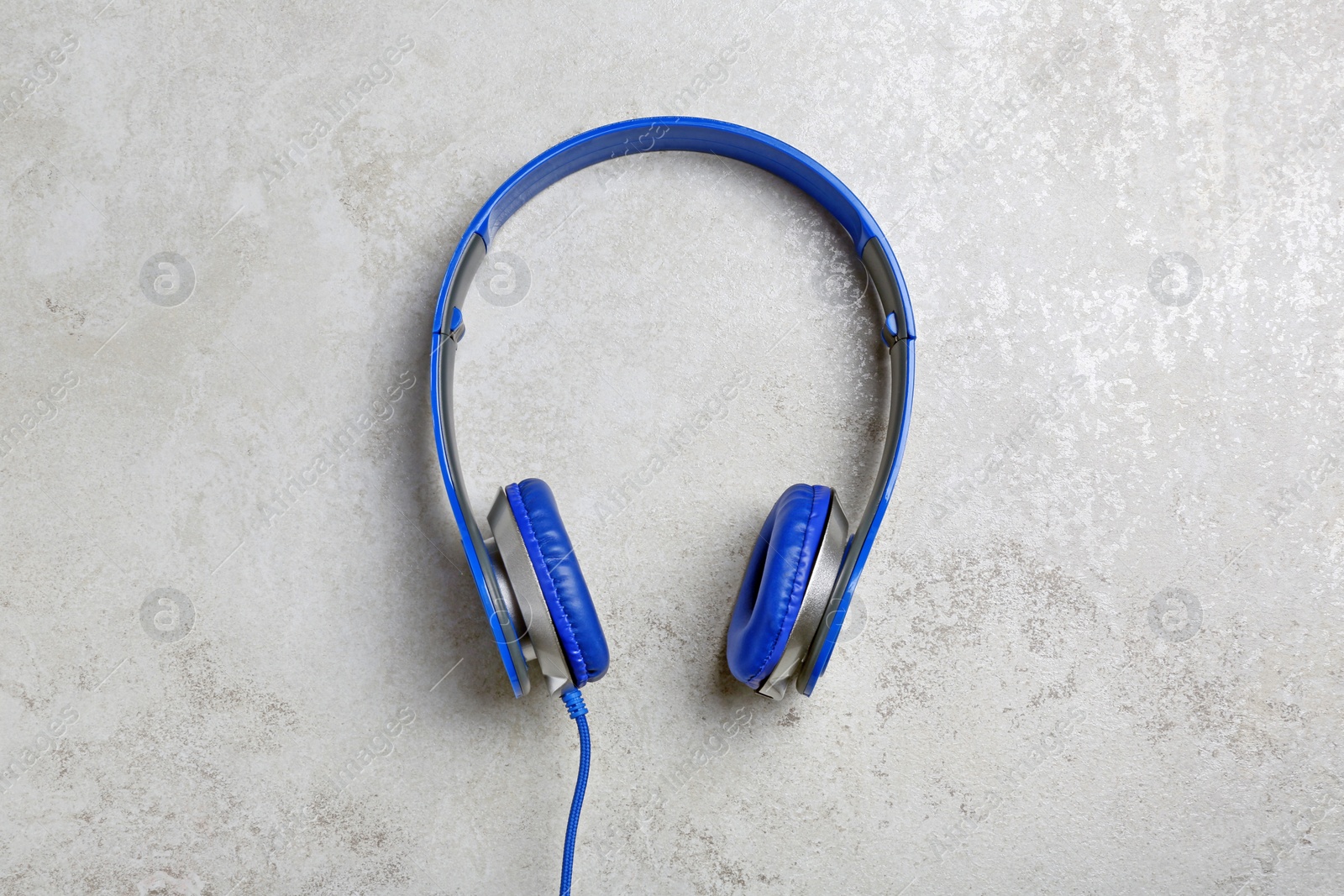 Photo of Stylish headphones on grey background, top view