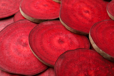 Photo of Slices of fresh beets as background, closeup