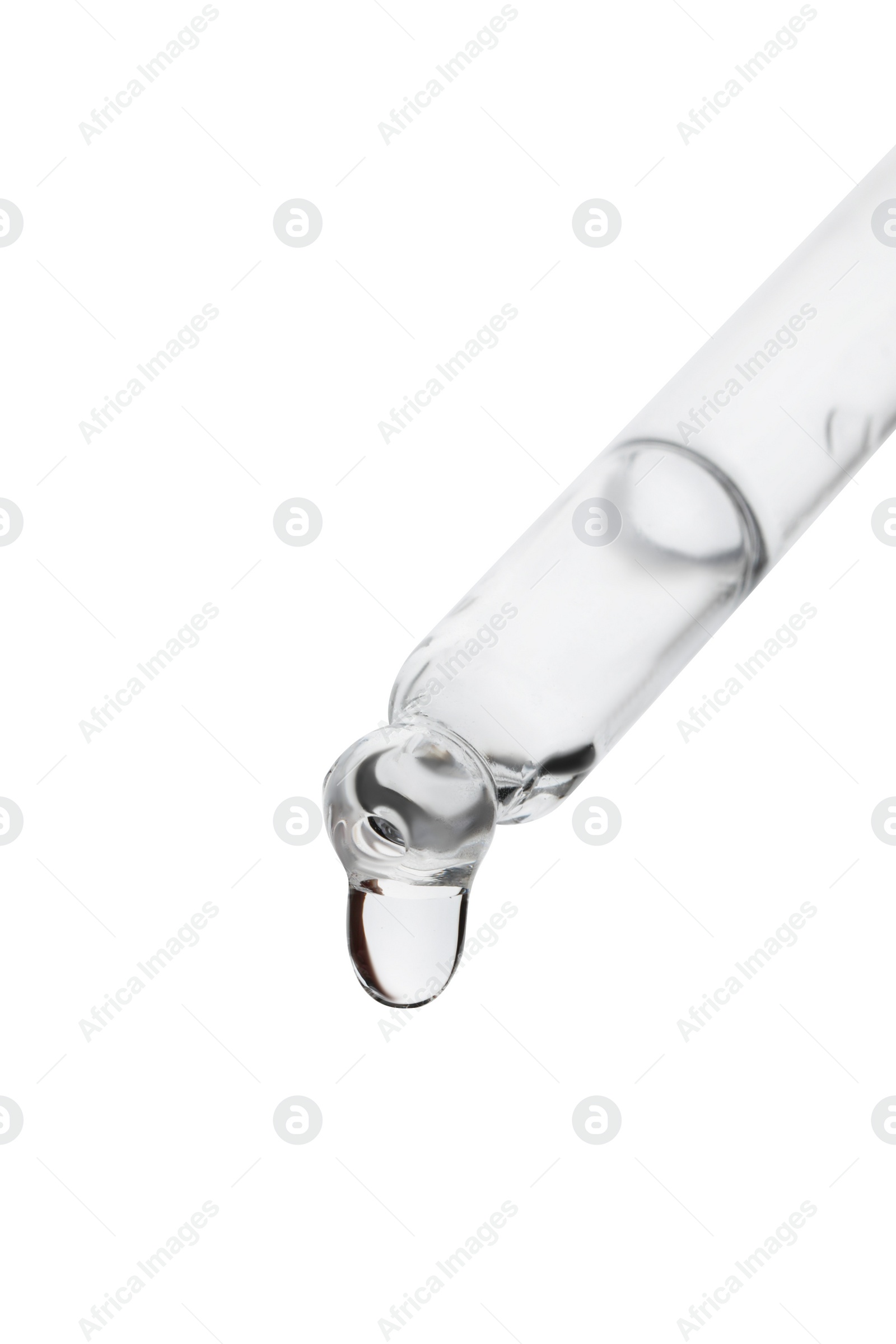 Photo of Dripping clear facial serum from pipette on white background, closeup