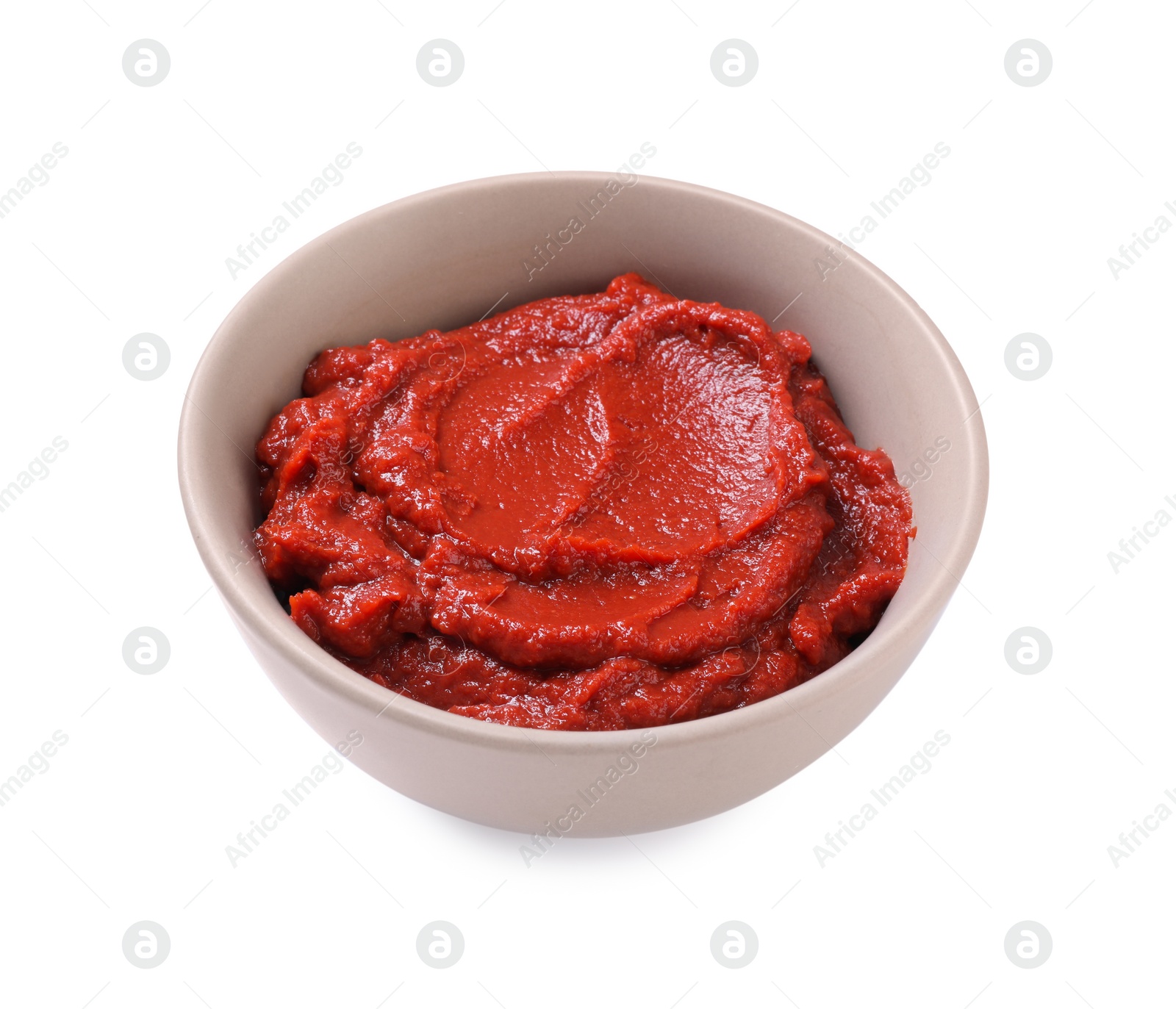 Photo of Bowl of tasty tomato paste isolated on white