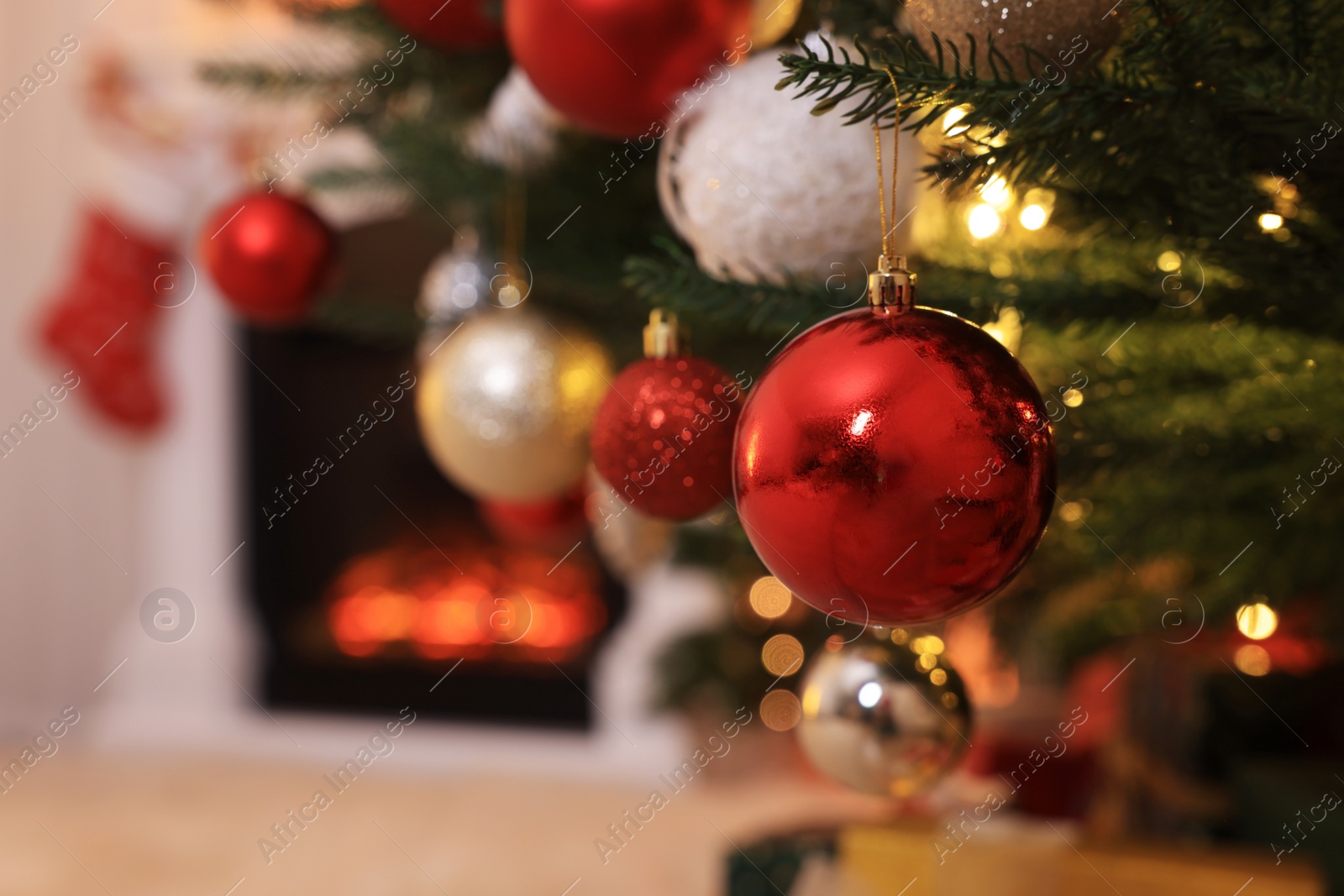 Photo of Closeup view of beautifully decorated Christmas tree indoors