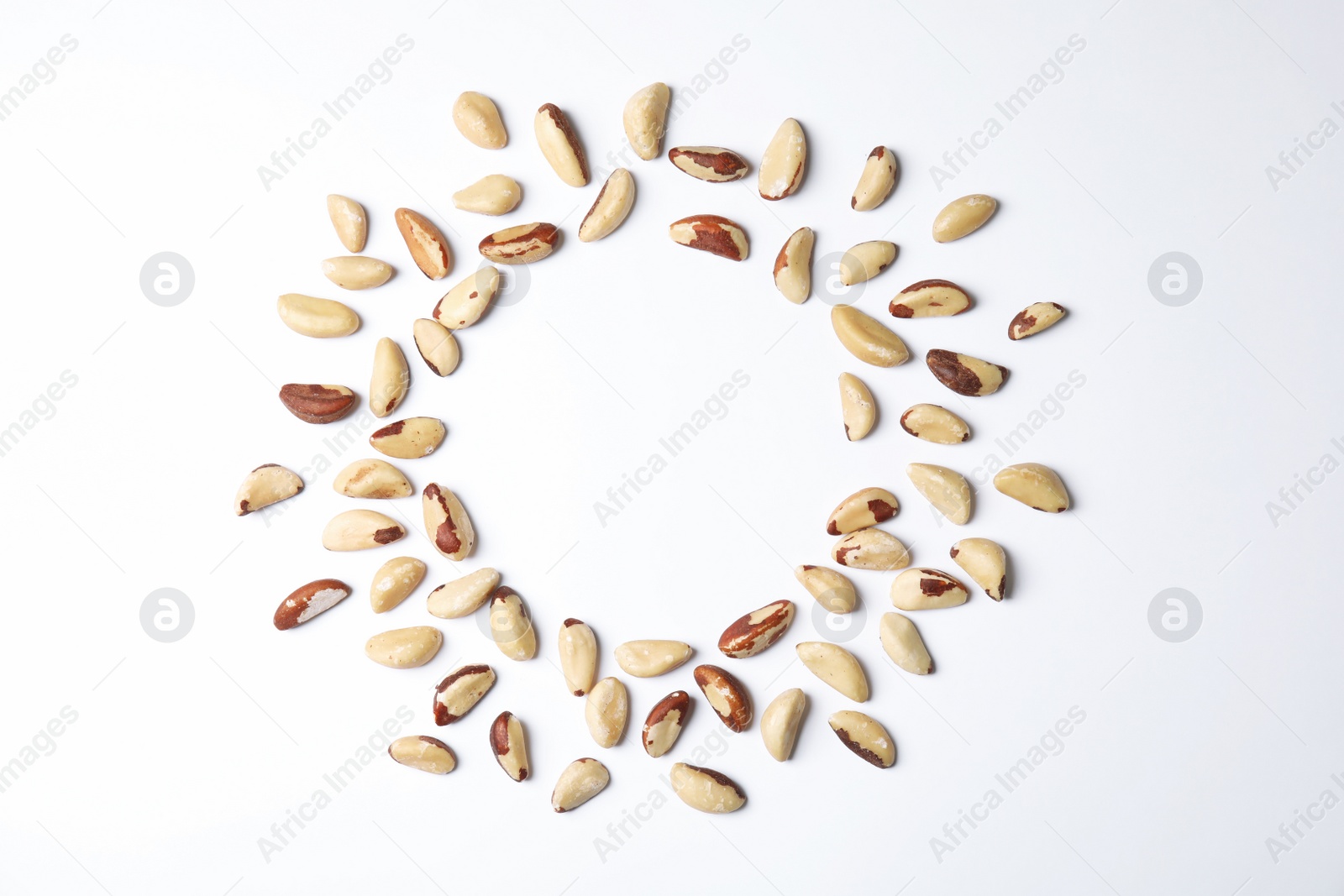 Photo of Composition with Brazil nuts and space for text on white background, top view