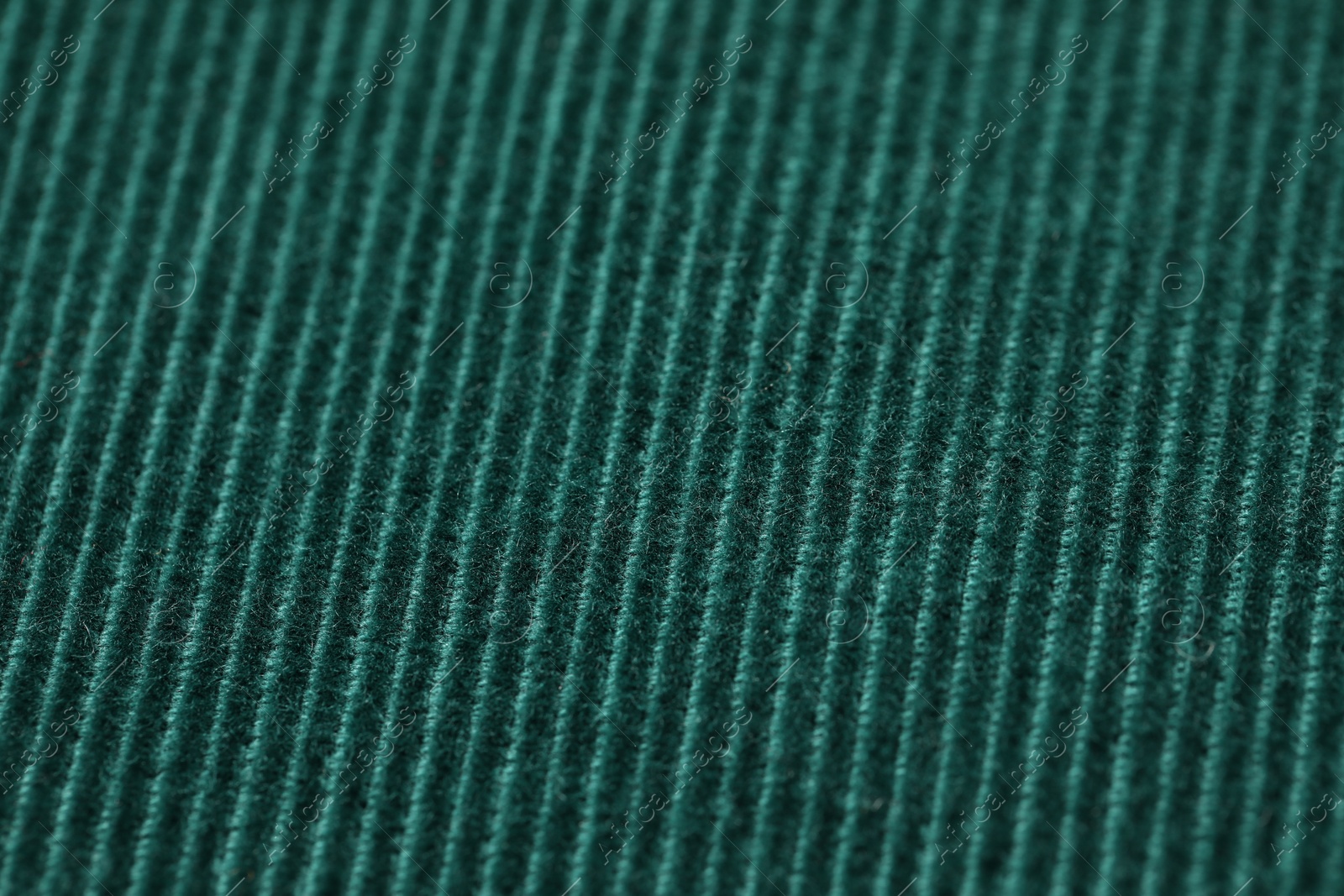 Photo of Texture of soft dark green knitted fabric as background, closeup