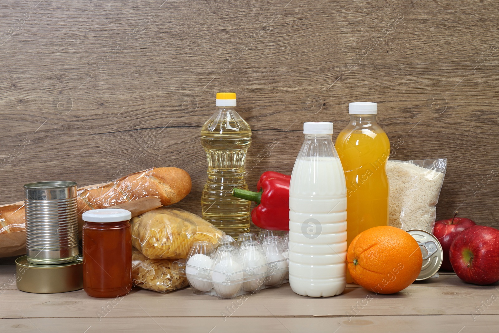 Photo of Many different donation food on wooden table