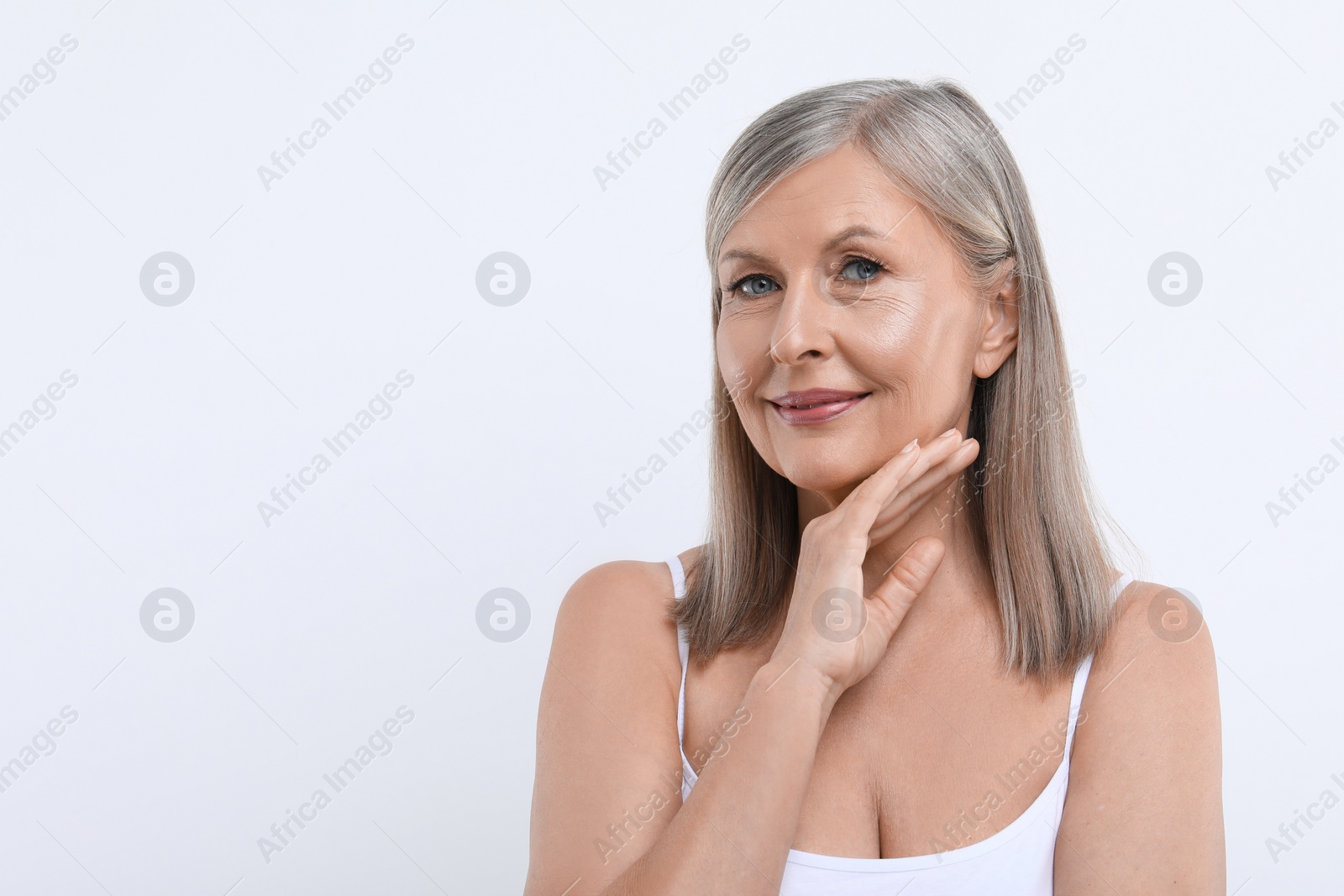 Photo of Portrait of beautiful senior woman on white background. Space for text