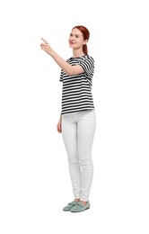 Happy woman pointing at something on white background