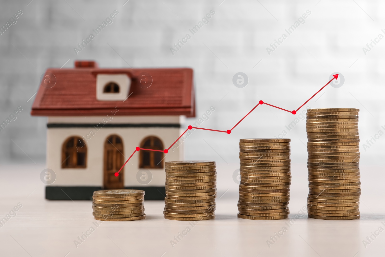 Image of Mortgage rate. Stacked coins, graph and model of house