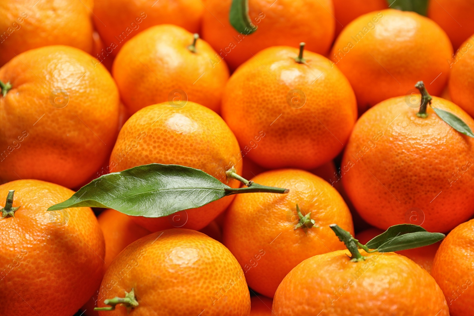 Photo of Delicious fresh ripe tangerines as background, closeup