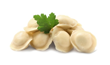 Photo of Boiled dumplings with parsley on white background