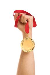 Photo of Man holding golden medal on white background, closeup. Space for design