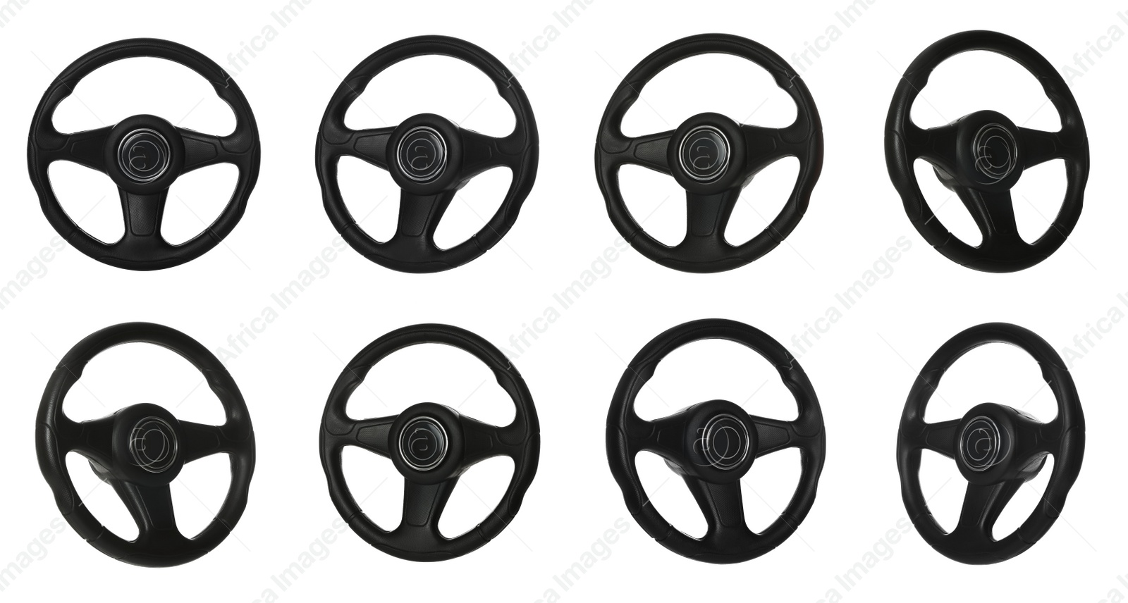 Image of Set with black steering wheels on white background 