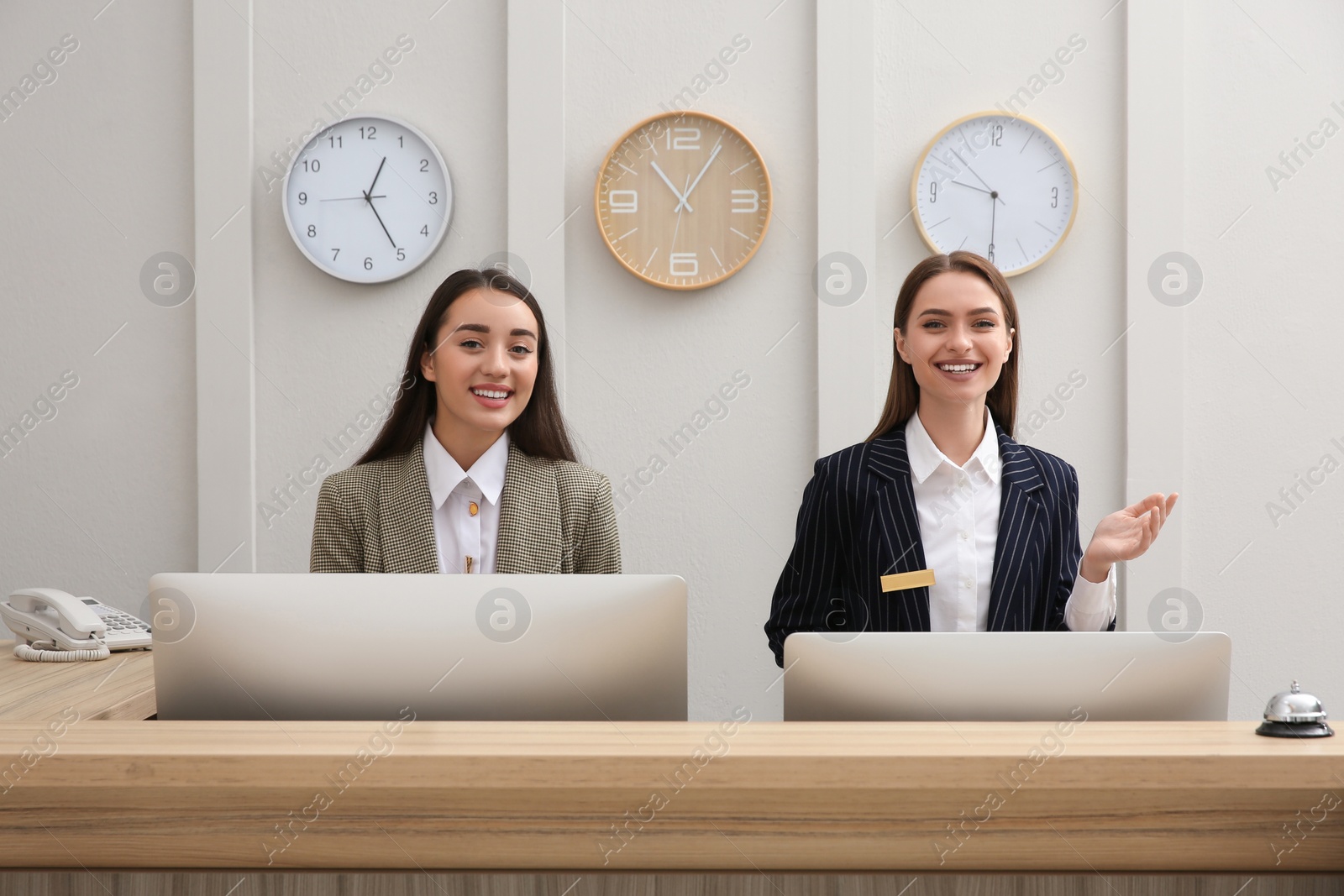 Photo of Beautiful receptionists working at counter in hotel