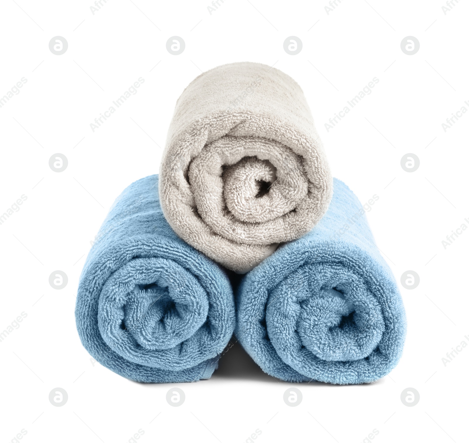 Photo of Rolled soft terry towels on white background