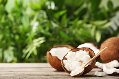 Photo of Composition with coconut oil on table against blurred background. Healthy cooking