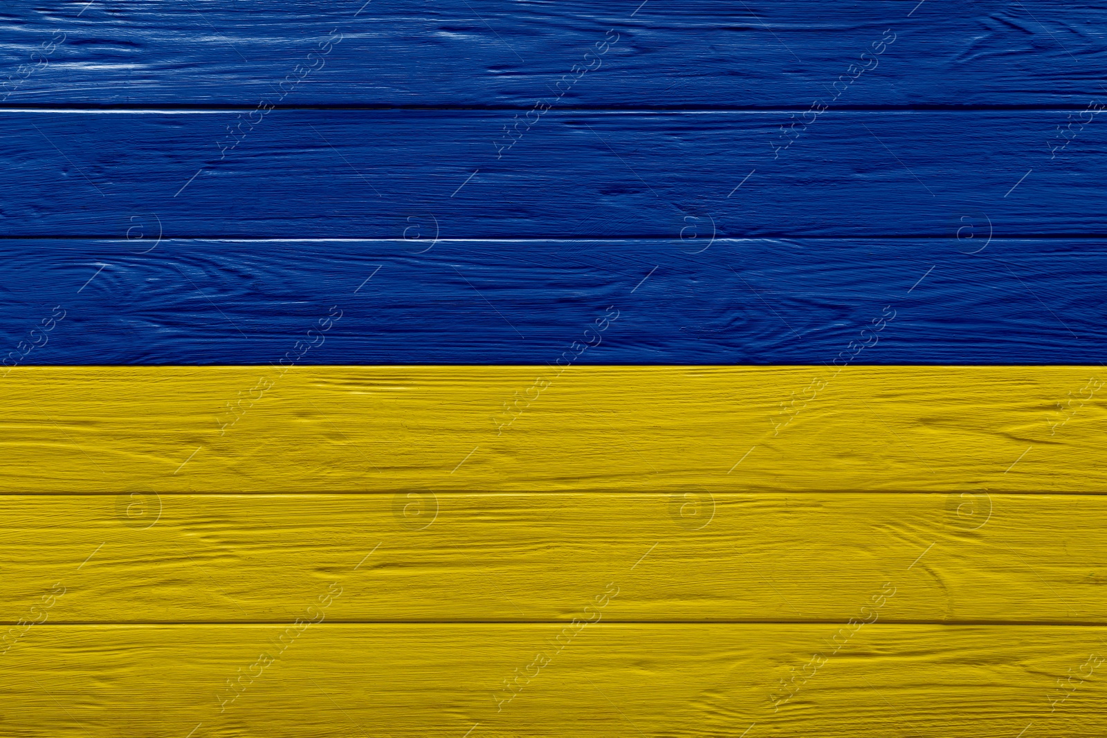 Image of National flag of Ukraine painted on wooden surface