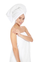 Photo of Portrait of young pretty woman with towels on white background