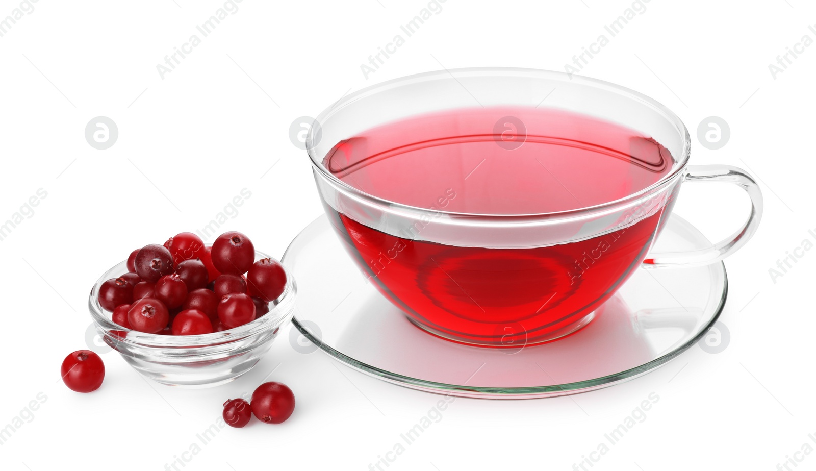 Photo of Cup of delicious cranberry tea and berries isolated on white