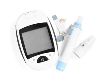 Photo of Glucometer, lancet pen and strips on white background, top view. Diabetes testing kit