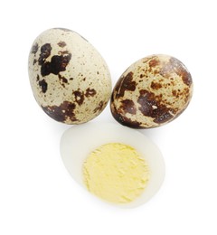 Photo of Unpeeled and peeled hard boiled quail eggs on white background, top view