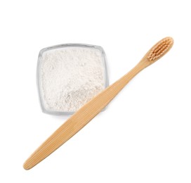 Photo of Bowl of tooth powder and brush on white background, top view