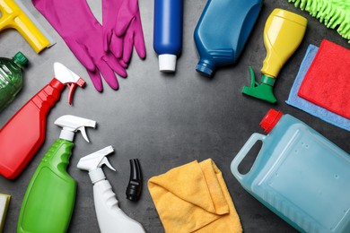 Frame of many different car cleaning products on dark background, flat lay. Space for text