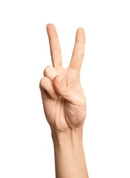 Photo of Woman showing number two on white background, closeup. Sign language