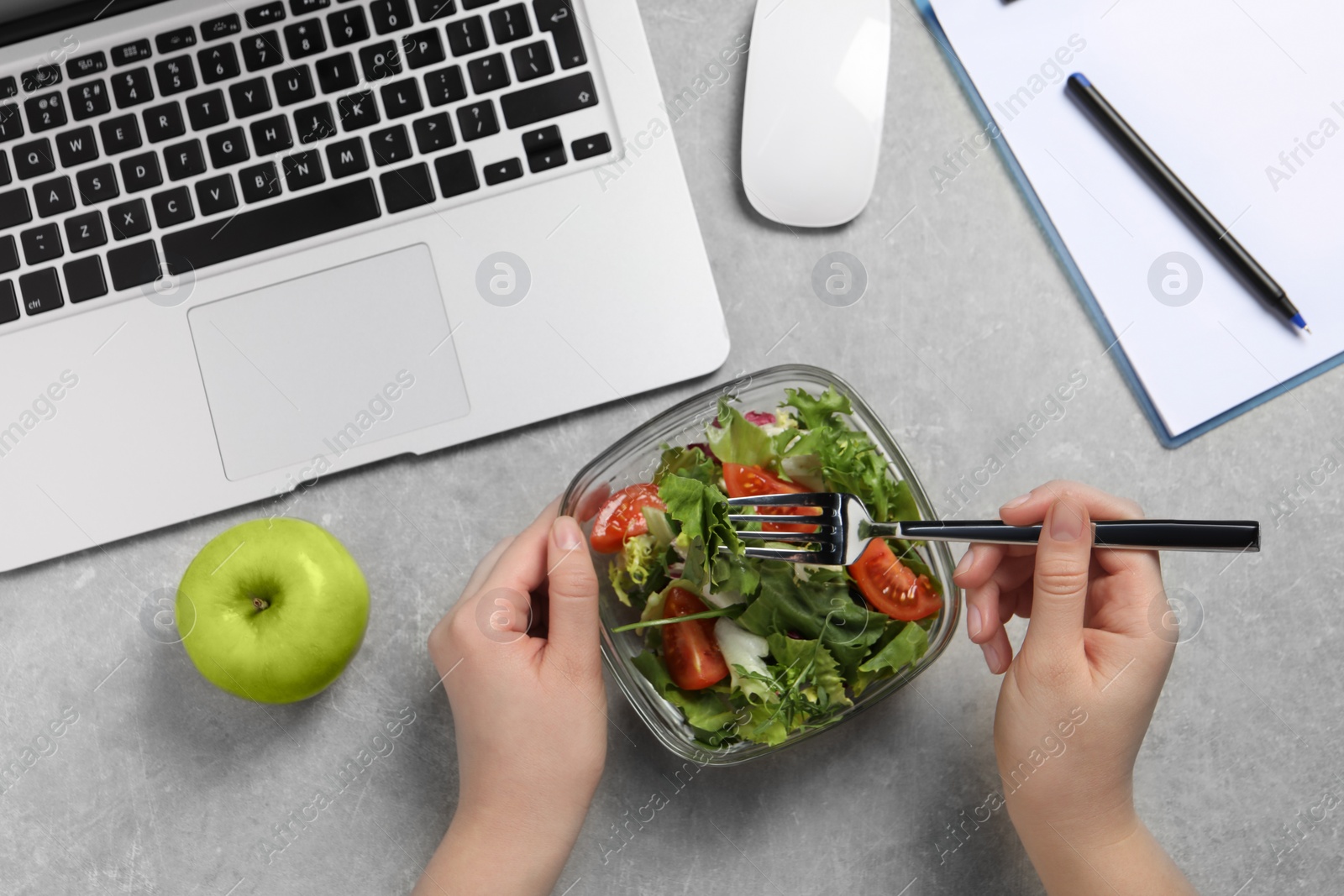 Photo of Office employee having business lunch at workplace, top view