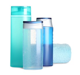 Photo of Different shower gel bottles and towel on white background
