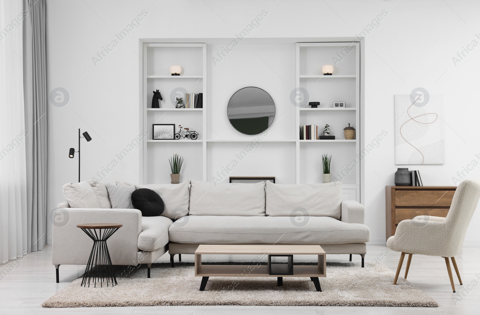 Photo of Beautiful carpet, furniture and accessories in living room