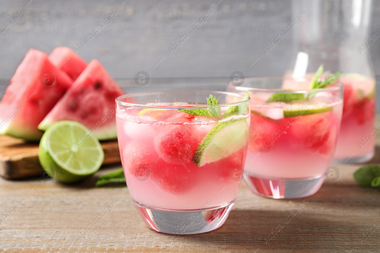 Photo of Tasty refreshing watermelon drink on wooden table