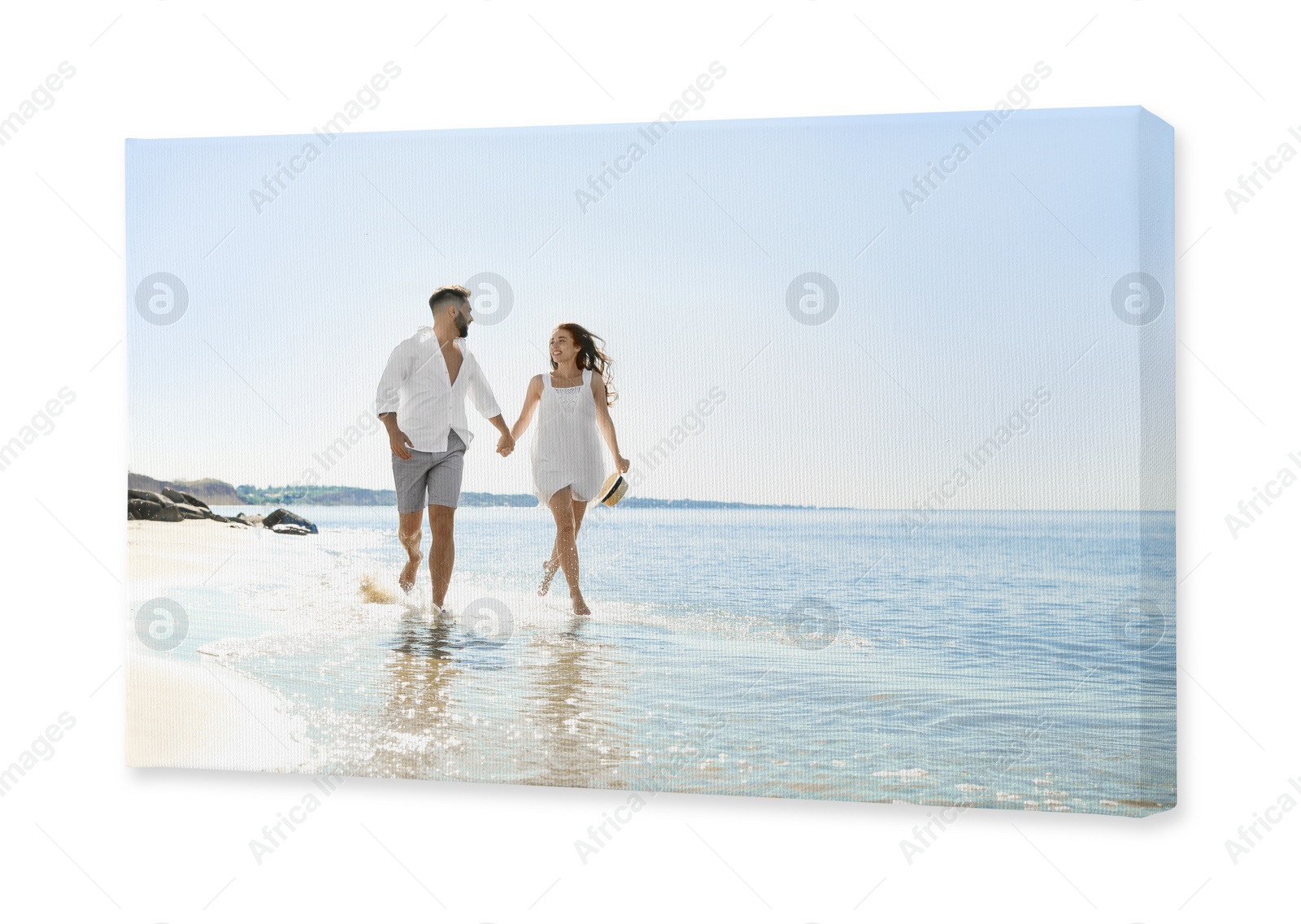Image of Photo printed on canvas, white background. Happy young couple running on beach near sea