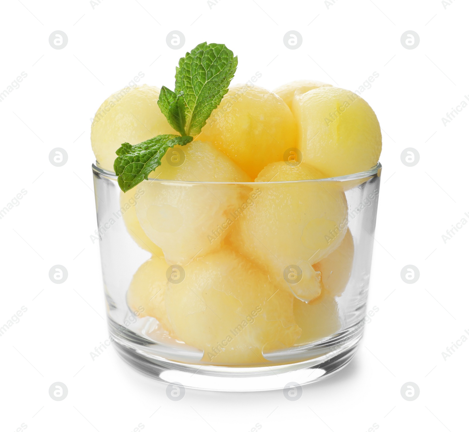 Photo of Glass with melon balls on white background