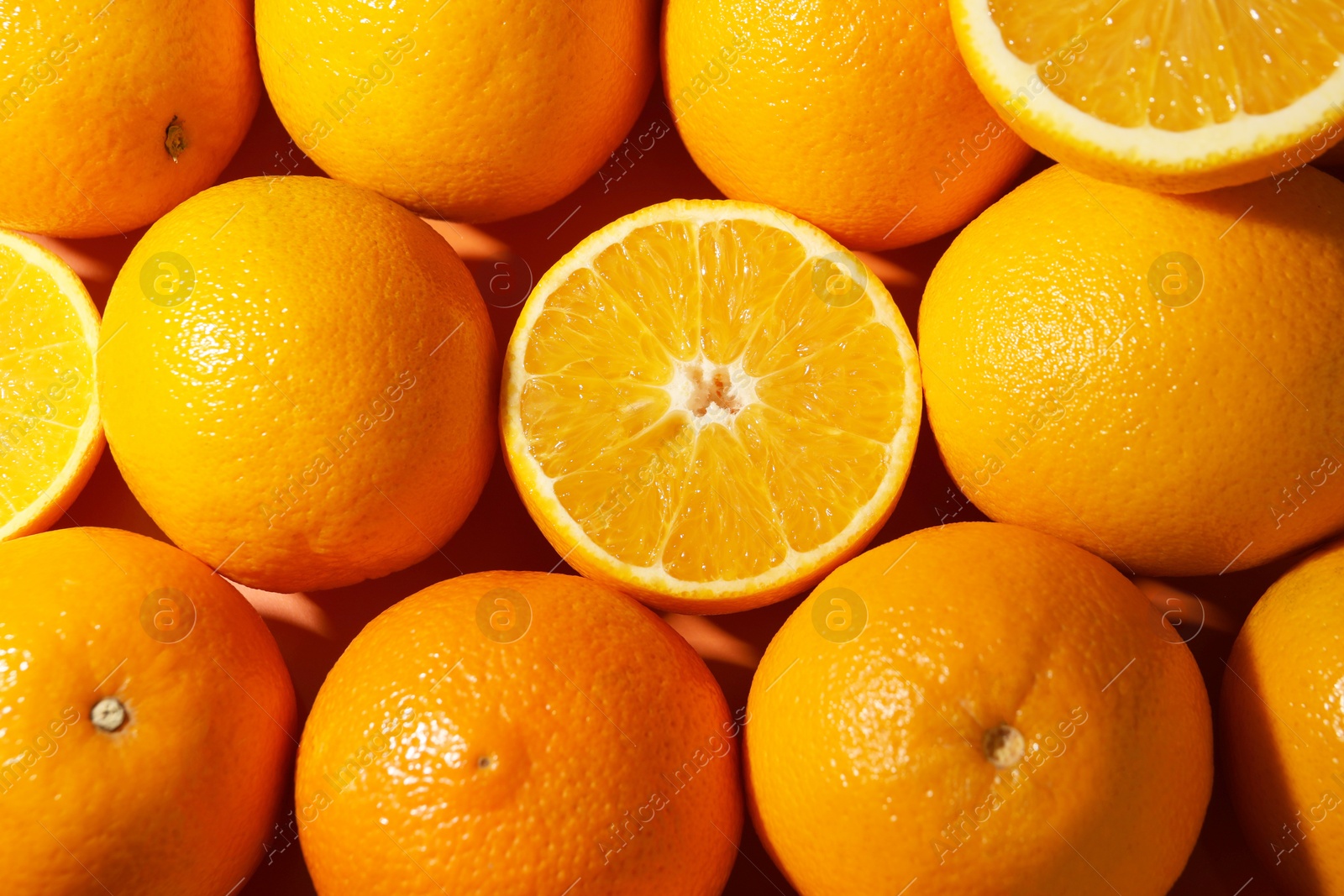Photo of Tasty ripe fresh oranges as background, top view