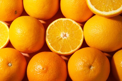 Photo of Tasty ripe fresh oranges as background, top view