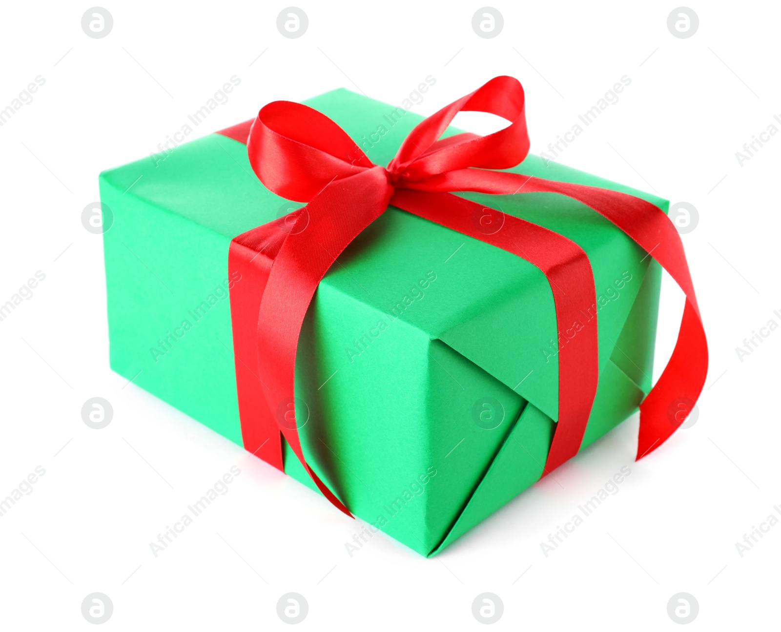 Photo of Christmas gift box decorated with ribbon bow on white background