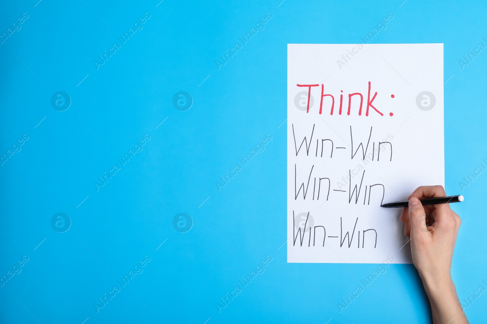 Photo of Woman writing motivational inscriptions, top view with space for text. Victory concept