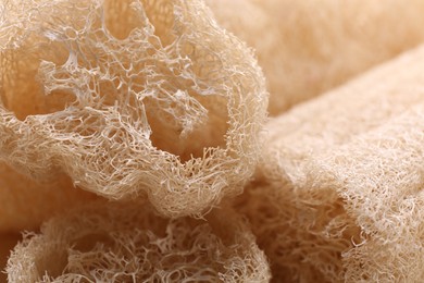 Photo of Natural loofah sponges as background, closeup view