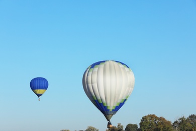 Photo of Beautiful view of hot air balloons in blue sky