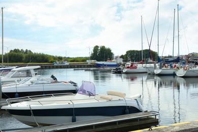 Photo of Beautiful view of city pier with modern boats