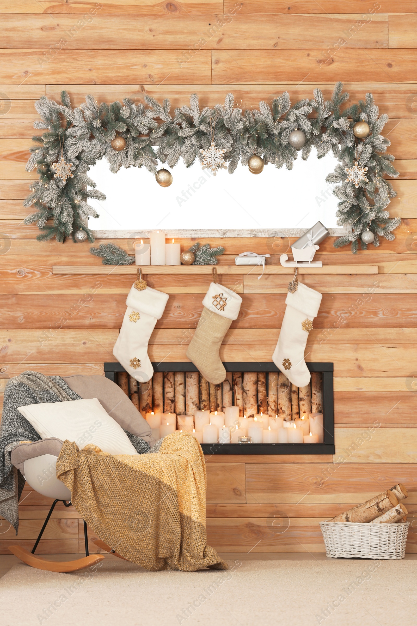 Photo of Beautiful Christmas interior of living room with decorative fireplace