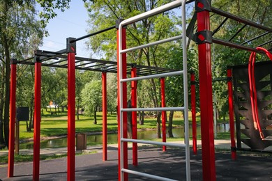 Empty outdoor gym with exercise equipment in park