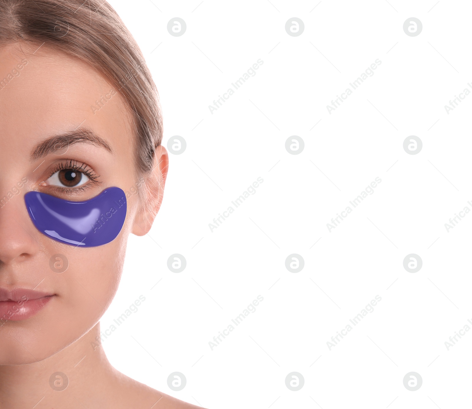 Photo of Beautiful young woman with blue under eye patch on white background