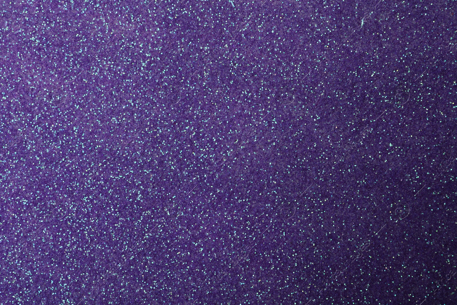 Photo of Beautiful shiny violet glitter as background, closeup