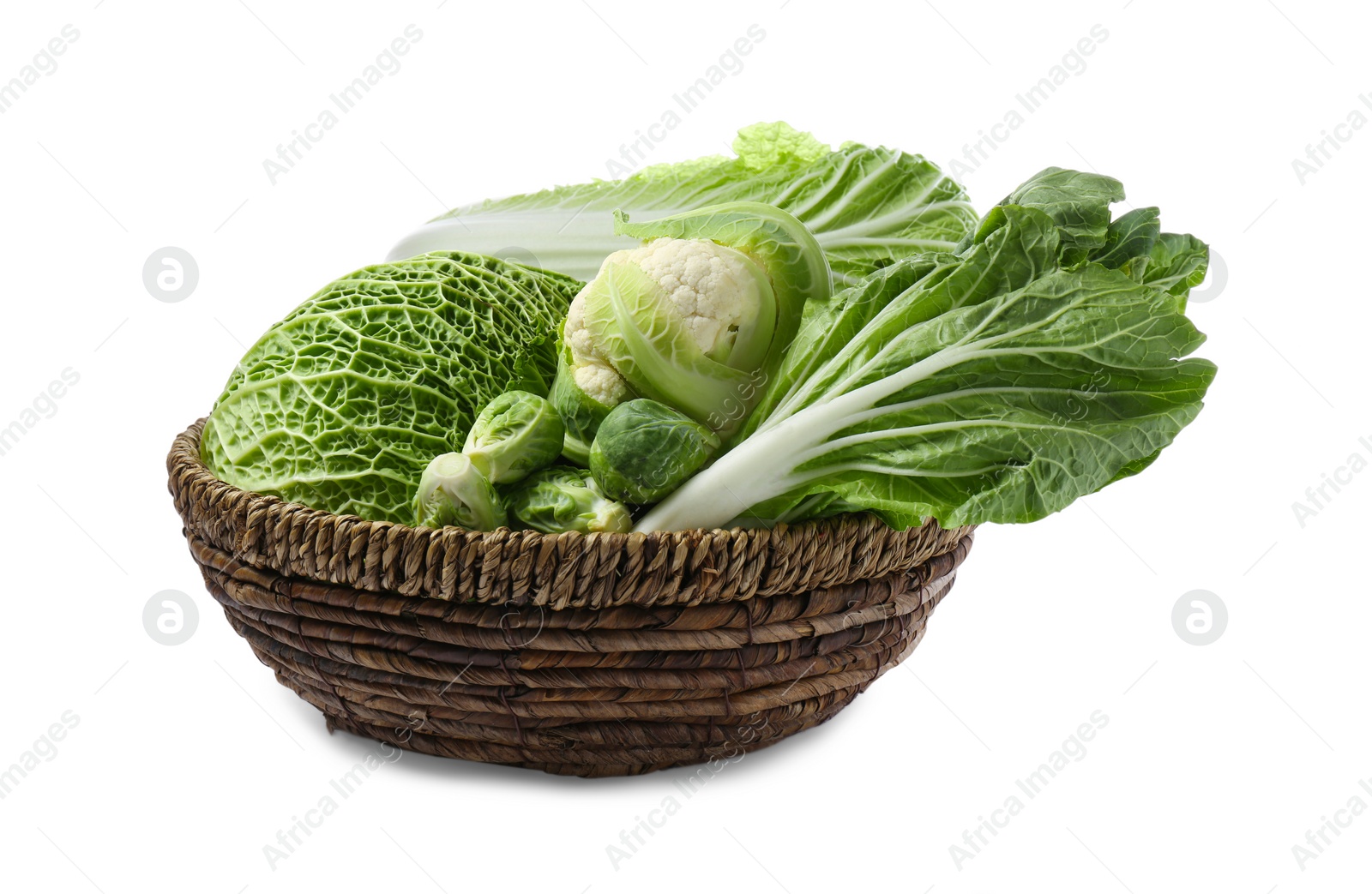 Photo of Wicker bowl with different types of fresh cabbage on white background