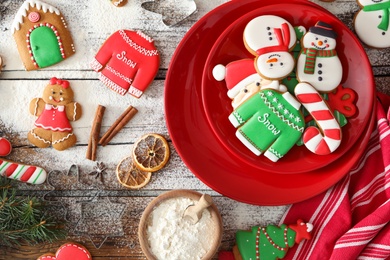 Flat lay composition with delicious homemade Christmas cookies on wooden table