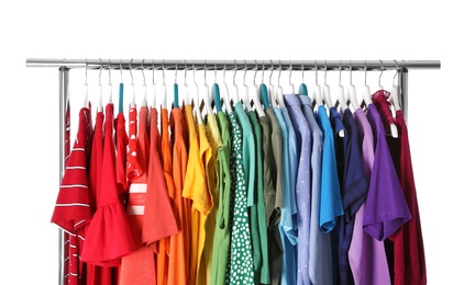 Photo of Wardrobe rack with different colorful clothes on white background